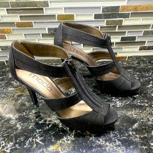 Woman’s size 8.5 Black Sparkly heels. Zipper front.